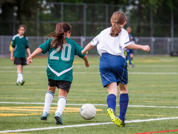 Girls playing soccer